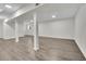 Spacious finished basement area with light wood flooring at 4843 Caboose Nw Ln, Acworth, GA 30102