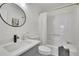 Modern bathroom featuring a stylish vanity, round mirror, and shower at 4843 Caboose Nw Ln, Acworth, GA 30102