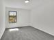 Spacious bedroom with neutral carpeting and a large window at 4843 Caboose Nw Ln, Acworth, GA 30102