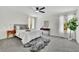 Spacious bedroom with soft carpet, natural light, modern ceiling fan, and stylish décor at 4843 Caboose Nw Ln, Acworth, GA 30102