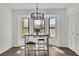 Charming breakfast nook with bay window, modern chandelier, and cozy seating at 4843 Caboose Nw Ln, Acworth, GA 30102