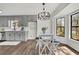 Cozy breakfast nook bathed in natural light with modern light fixture at 4843 Caboose Nw Ln, Acworth, GA 30102