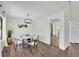 Elegant dining room with modern lighting fixture and luxury vinyl flooring at 4843 Caboose Nw Ln, Acworth, GA 30102