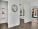 Hallway with white walls, wood floors and view into the Gathering room at 4843 Caboose Nw Ln, Acworth, GA 30102