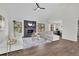 Beautiful living room with a fireplace and seamless flow to dining area at 4843 Caboose Nw Ln, Acworth, GA 30102