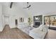 Open living room with fireplace, hardwood floors, high ceilings, and access to an outdoor deck at 4843 Caboose Nw Ln, Acworth, GA 30102