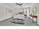 Cozy main bedroom with plush rug, ceiling fan and modern decor at 4843 Caboose Nw Ln, Acworth, GA 30102