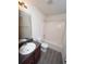 Bathroom features a vanity with dark cabinets, toilet, and a shower and bathtub combo at 7267 Appaloosa Cv, Fairburn, GA 30213