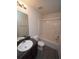 Bathroom featuring a single vanity with a granite countertop, tub-shower combo, and vinyl flooring at 7267 Appaloosa Cv, Fairburn, GA 30213