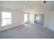 Bedroom includes vaulted ceilings, two windows providing natural light, and carpet flooring at 7267 Appaloosa Cv, Fairburn, GA 30213