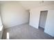 Cozy bedroom with neutral carpeting, bright windows, and closet providing a tranquil retreat at 7267 Appaloosa Cv, Fairburn, GA 30213