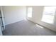 Comfortable bedroom with carpeted floors and natural lighting, creating a serene living space at 7267 Appaloosa Cv, Fairburn, GA 30213