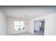 Dining room with chandelier lighting and large windows allowing for natural light at 7267 Appaloosa Cv, Fairburn, GA 30213
