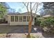 Backyard view of the home, showcasing a screened-in porch at 810 Commodore Nw Dr, Atlanta, GA 30318