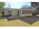 Backyard view of the home, featuring a screened-in porch at 810 Commodore Nw Dr, Atlanta, GA 30318