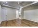 Open bedroom with a ceiling fan, gleaming hardwood floors, and neutral-colored walls at 810 Commodore Nw Dr, Atlanta, GA 30318