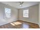 Bedroom featuring hardwood floors, neutral paint, and natural light at 810 Commodore Nw Dr, Atlanta, GA 30318