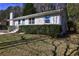 Charming one-story home with well-manicured lawn and freshly painted white siding at 810 Commodore Nw Dr, Atlanta, GA 30318