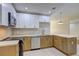 Well-lit kitchen featuring modern stainless appliances, bright countertops, and ample cabinet space at 810 Commodore Nw Dr, Atlanta, GA 30318