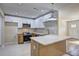 Modern kitchen featuring stainless steel appliances, a spacious island, and stylish two-tone cabinetry at 810 Commodore Nw Dr, Atlanta, GA 30318