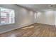Spacious living room with hardwood floors, recessed lighting, and large window with a view of the backyard at 810 Commodore Nw Dr, Atlanta, GA 30318