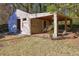 Backyard shed with covered space for storage at 810 Commodore Nw Dr, Atlanta, GA 30318