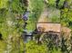 An aerial top-down view showcases the home nestled among lush greenery, highlighting its privacy and natural surroundings at 1350 Elizabeth Sw Ave, Atlanta, GA 30310