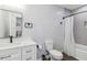 Modern bathroom with a bathtub shower, modern fixtures, and white accents at 1350 Elizabeth Sw Ave, Atlanta, GA 30310