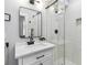 Modern bathroom with a glass-enclosed shower, sleek black fixtures, and white subway tile at 1350 Elizabeth Sw Ave, Atlanta, GA 30310