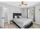 Cozy bedroom with a black headboard, ceiling fan, and natural light at 1350 Elizabeth Sw Ave, Atlanta, GA 30310