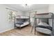 This bedroom features sturdy metal bunk beds, providing a practical and space-saving sleeping arrangement at 1350 Elizabeth Sw Ave, Atlanta, GA 30310