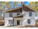 Charming two-story home featuring modern siding, black-framed windows, and a welcoming front porch at 1350 Elizabeth Sw Ave, Atlanta, GA 30310