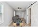 Spacious living room with a foosball table, a ceiling fan, and a cozy couch at 1350 Elizabeth Sw Ave, Atlanta, GA 30310