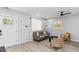 Bright living room with hardwood floors, a gray sofa, and stylish decor, creating a cozy atmosphere at 1350 Elizabeth Sw Ave, Atlanta, GA 30310