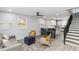 Open-concept living and dining area with modern furnishings, hardwood floors, and plenty of natural light at 1350 Elizabeth Sw Ave, Atlanta, GA 30310