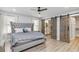 The main bedroom boasts a king bed, ensuite bath and walk-in closet behind custom sliding barn doors at 1350 Elizabeth Sw Ave, Atlanta, GA 30310