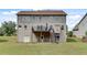 Back exterior showcasing a deck and backyard at 179 Bradshaw Park Dr, Woodstock, GA 30188