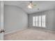 Vaulted bedroom with ceiling fan, large window, plantation shutters and neutral carpet at 179 Bradshaw Park Dr, Woodstock, GA 30188
