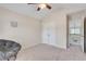 Inviting bedroom featuring vaulted ceilings, a ceiling fan, closet, and neutral carpet at 179 Bradshaw Park Dr, Woodstock, GA 30188