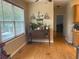 Cozy dining area featuring hardwood floors and ample natural light from the large window at 179 Bradshaw Park Dr, Woodstock, GA 30188