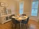Cozy dining room with hardwood floors, and a round table perfect for intimate gatherings at 179 Bradshaw Park Dr, Woodstock, GA 30188