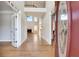 Inviting foyer with hardwood floors, soaring ceilings, and views into the living room at 179 Bradshaw Park Dr, Woodstock, GA 30188