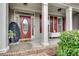 Welcoming front porch with classic columns and an elegant front door at 179 Bradshaw Park Dr, Woodstock, GA 30188