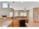 Kitchen with countertops and stainless steel sink, flowing into the living room at 179 Bradshaw Park Dr, Woodstock, GA 30188