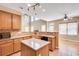 Open kitchen area with island, stainless appliances and lots of sunlight at 179 Bradshaw Park Dr, Woodstock, GA 30188