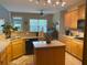 Functional kitchen featuring a center island, tile countertops, and modern appliances at 179 Bradshaw Park Dr, Woodstock, GA 30188