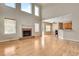 Spacious living room with fireplace, large windows, and open floorplan to the kitchen at 179 Bradshaw Park Dr, Woodstock, GA 30188