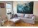 Cozy room with comfortable seating, a side table, and a tapestry of a forest at 179 Bradshaw Park Dr, Woodstock, GA 30188
