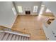 Open-concept living area with hardwood floors, fireplace, and ample natural light; perfect for entertaining at 179 Bradshaw Park Dr, Woodstock, GA 30188
