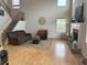Bright and airy living room with a cozy fireplace and an open staircase leading upstairs at 179 Bradshaw Park Dr, Woodstock, GA 30188